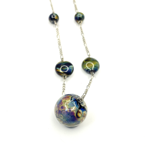 A necklace featuring handmade lampwork beads linked by sterling slilver chain